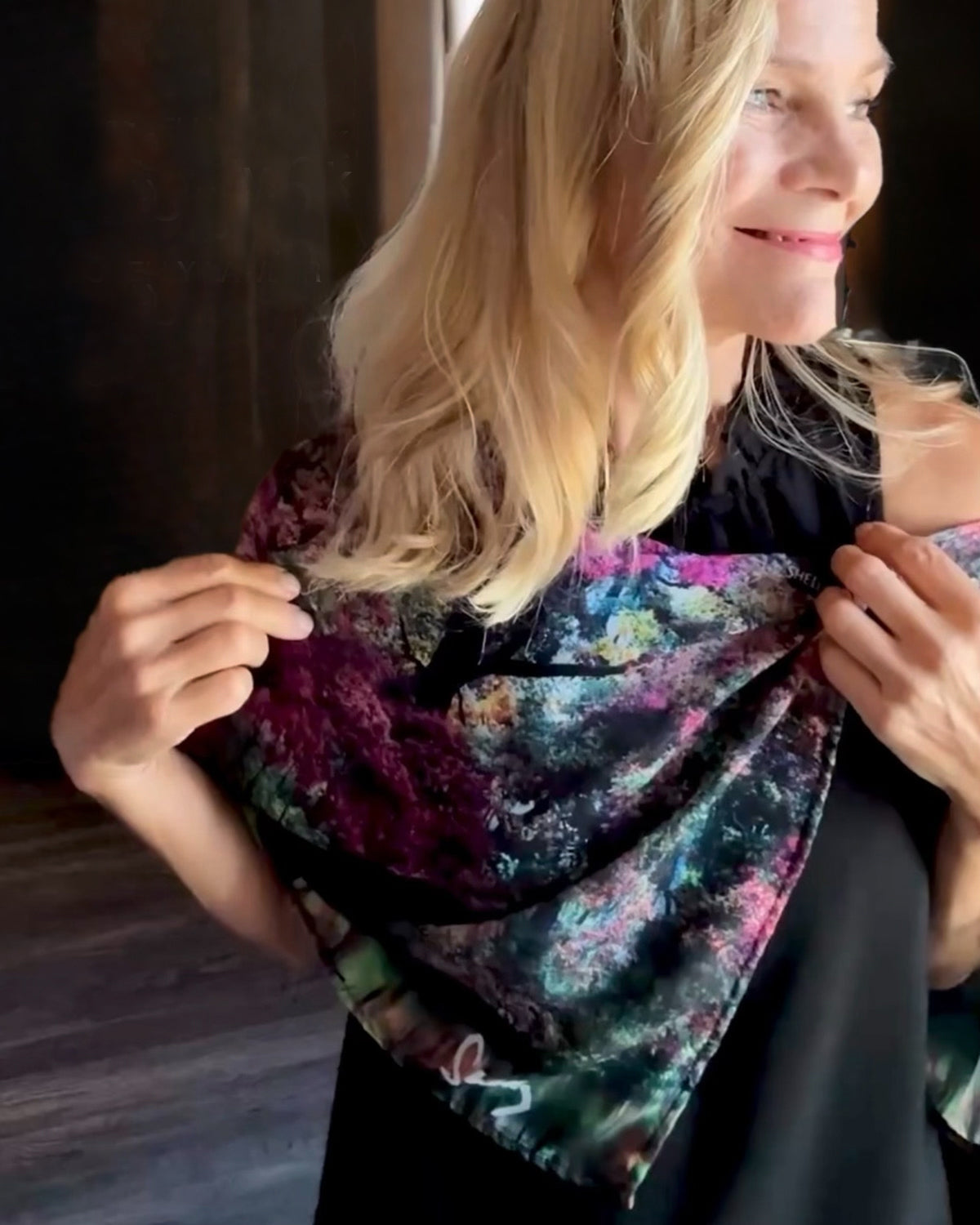 Mighty Oak Scarf styling demonstration showing signature pre-tied design slipping over head