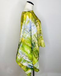 Side view of Almost Poncho showing drape and original abstract artwork on lightweight fabric