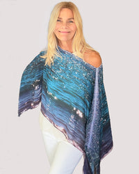 Blue Diamonds Poncho worn off one shoulder showing flowing fabric