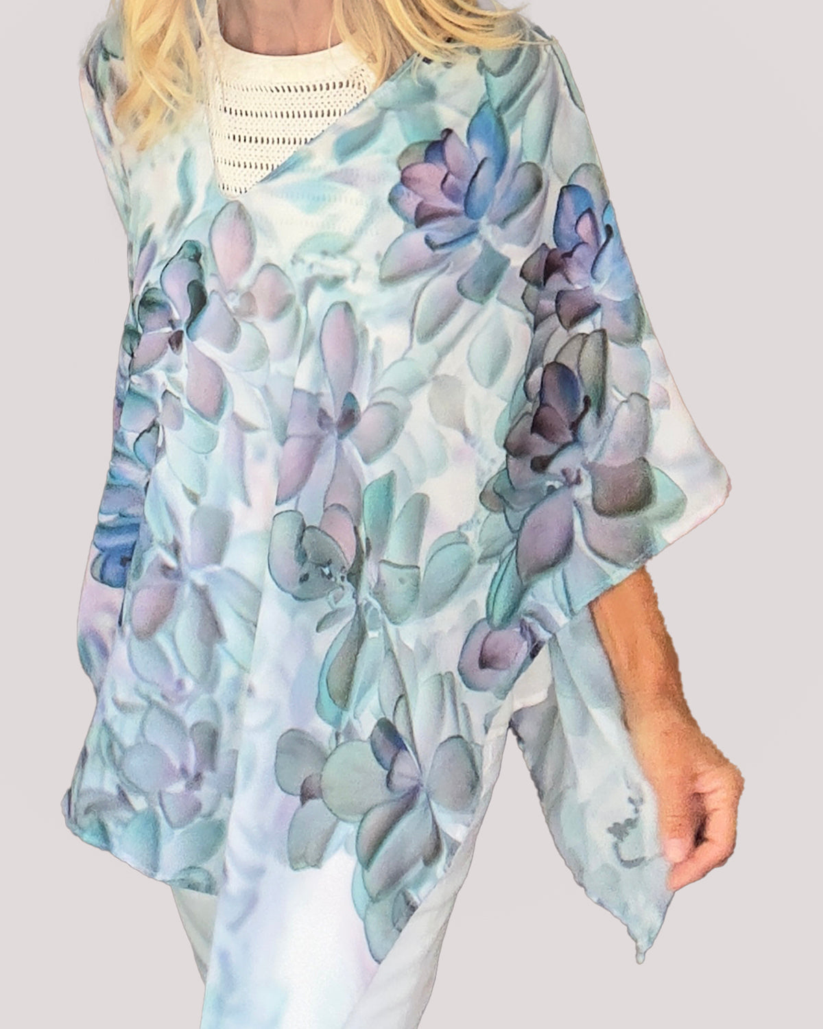 Poncho shown worn as a tunic with lightweight flowing fabric in teal, purple and blue
