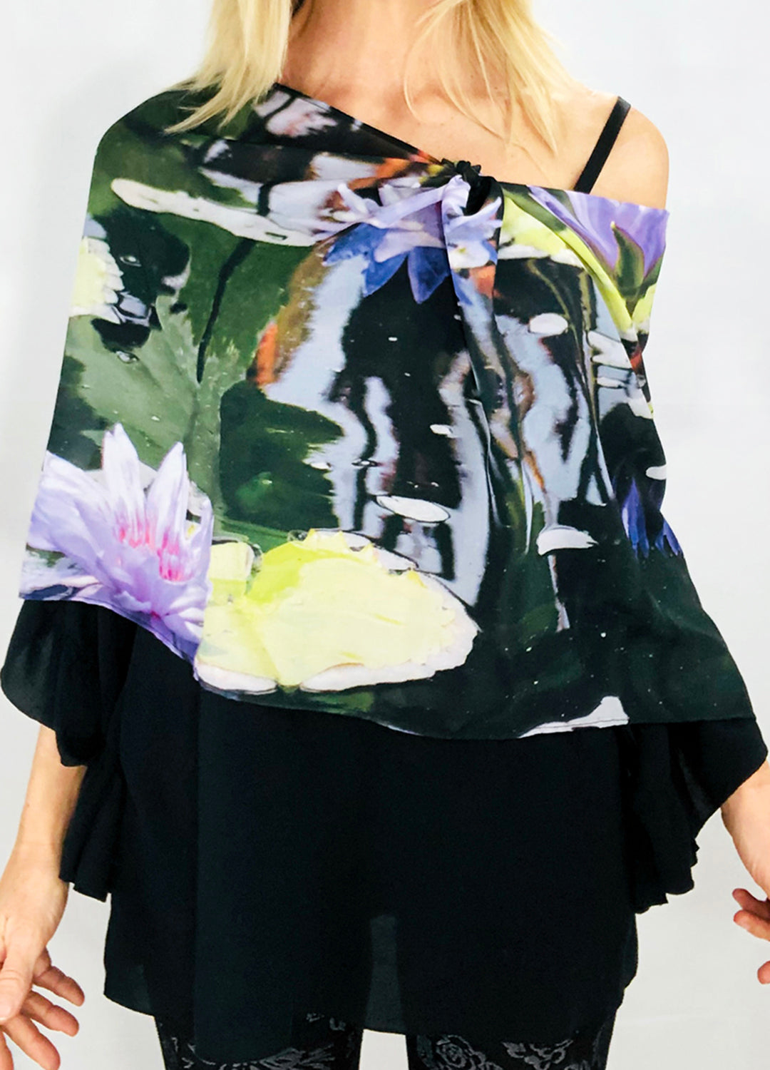 Dream Scarf worn draped over one shoulder showing, signature pre-tied design, waterlilies pattern
