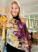 Flow Poncho slip over head design, draped across body, showcasing purple golden tone artwork in lightweight flowing fabric