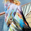 Closeup blue green poncho flowing in wind 