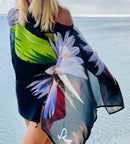 Lotus Flower Poncho in purple black green  floral pattern showing lightweight flowing fabric