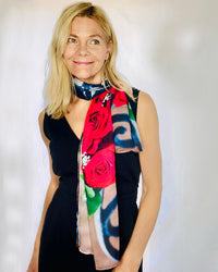 Roses Scarf worn as a long neckerchief, highlighting red rose artwork and fluid drape
