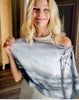 Beach Scarf styling demo, slip over head signature pre-tied design, showing black and white coastal theme artwork, lightweight flowing fabric