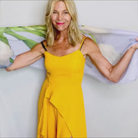 White Tulips Scarf styling demonstration showing how to tie and drape with lightweight flowing fabric in cream and white floral tones