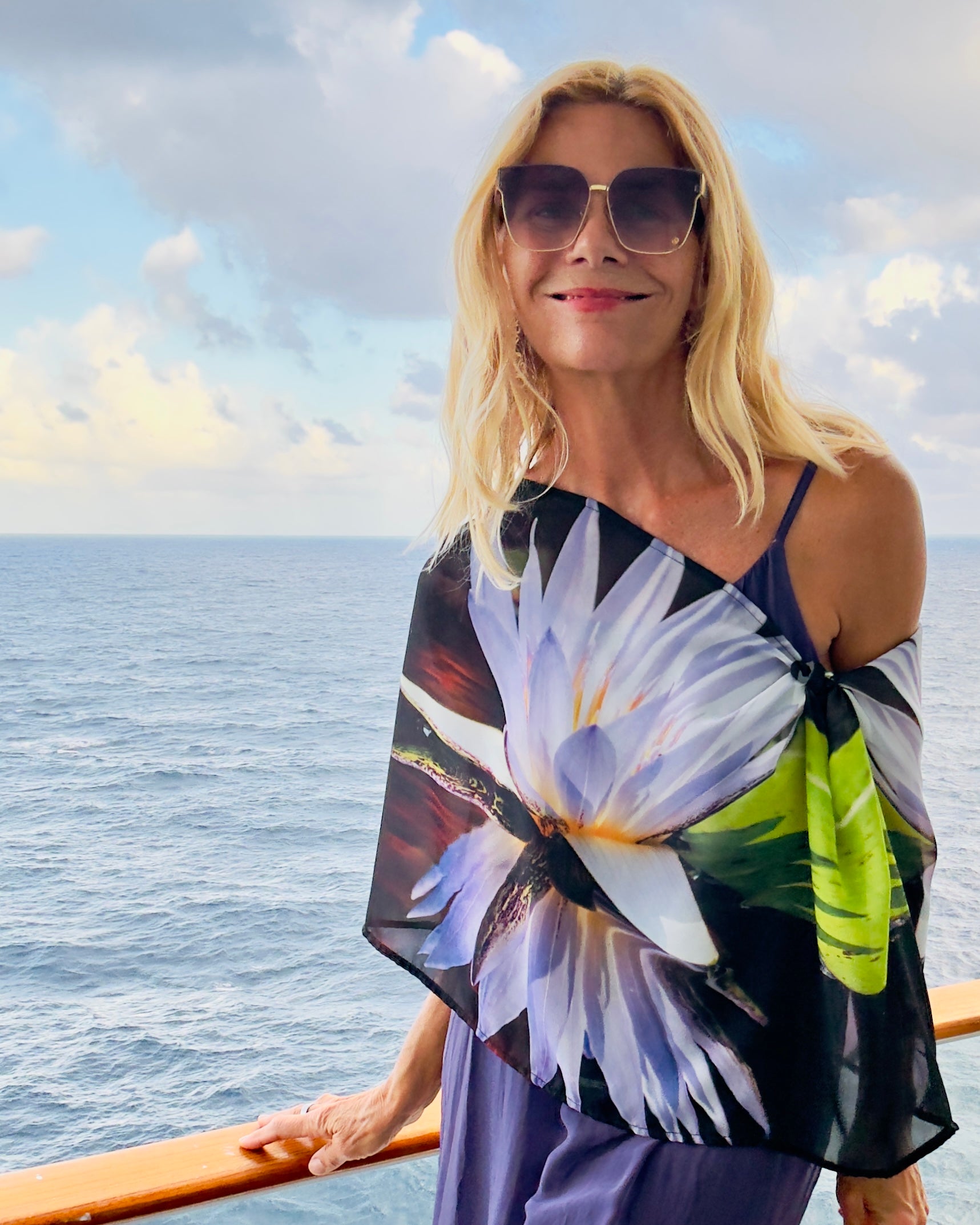 Shelly Lawler demonstrating how to style Lotus Scarf with easy Signature pre-tied design, showing versatile draping and chic neckerchief looks