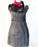 Roses Scarf displayed on mannequin styled as a neck wrap, showing red rose artwork and lightweight fabric texture
