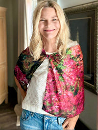 Fall Color Scarf with signature pre-tied design, worn as cape showing red, orange, and gold tones