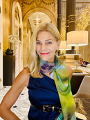Ombre Scarf styled as a long neckerchief, showcasing fluid fabric drape and abstract artwork in purple, green, and gold gradient tones